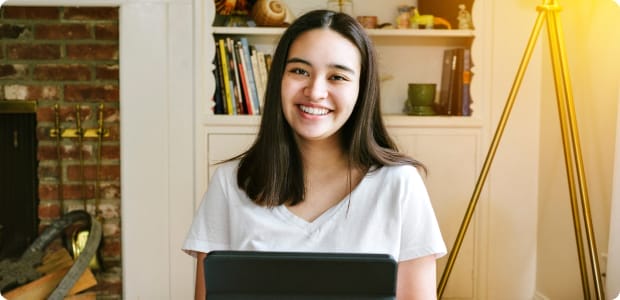 Student working with her laptop at home