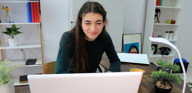 Girl smiling at screen